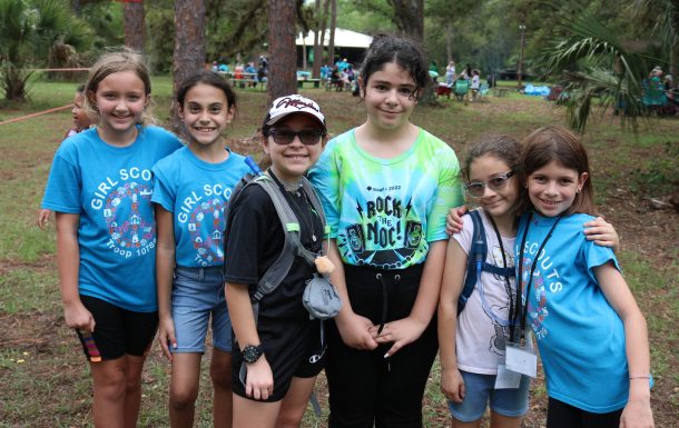 group of girls smiling outdoors