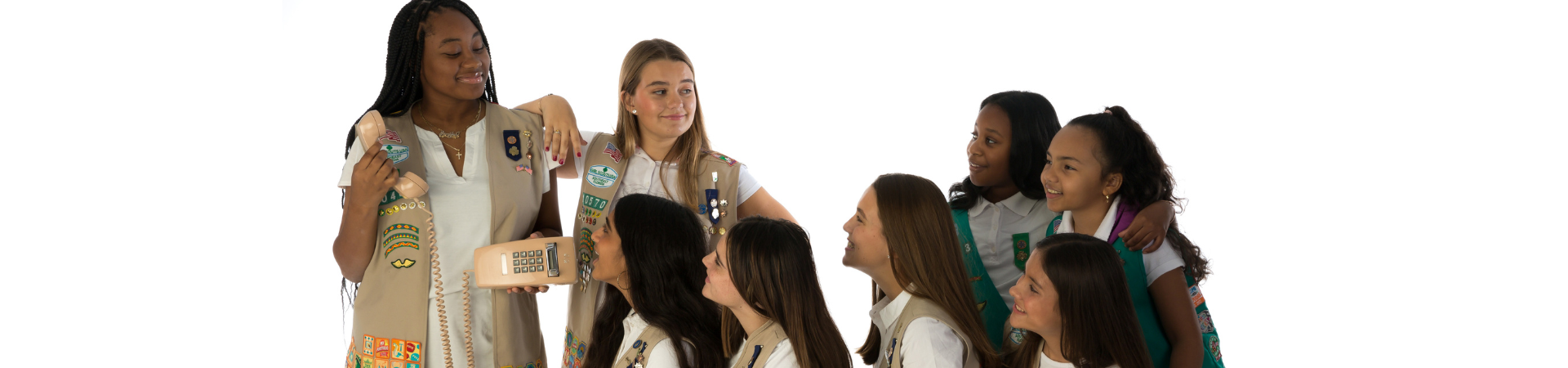  group of girl scouts looking at laptop computer 